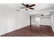 Bright living room featuring wood-look floors and an open concept layout at 200 S Bayshore Blvd, Clearwater, FL 33759