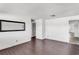 Minimalist living room with tile flooring, bright natural light, and an interior doorway at 200 S Bayshore Blvd, Clearwater, FL 33759