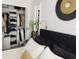 Bright bedroom featuring a walk-in closet, gold accents, and a comfortable bed at 2256 Spanish Dr # 42, Clearwater, FL 33763