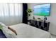 Bright bedroom featuring a TV, contemporary decor, modern furniture, and soft natural light at 2256 Spanish Dr # 42, Clearwater, FL 33763