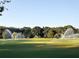 Expansive green lawn with lush trees and automated sprinklers at 2256 Spanish Dr # 42, Clearwater, FL 33763
