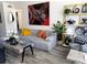 Bright living room featuring stylish decor, modern furniture, and a large unique painting at 2256 Spanish Dr # 42, Clearwater, FL 33763