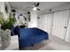 Main bedroom featuring modern furniture, a sliding door closet and a ceiling fan at 2256 Spanish Dr # 42, Clearwater, FL 33763