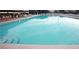 Large, inviting swimming pool with clear blue water and lounge chairs at 2256 Spanish Dr # 42, Clearwater, FL 33763
