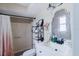 Well-lit bathroom featuring a white vanity, modern mirror, and a shower with a curtain at 2427 Comerwood Dr, Spring Hill, FL 34609