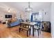 Open dining area featuring a modern light fixture and view of the living room at 2427 Comerwood Dr, Spring Hill, FL 34609