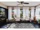 A sunroom with a black and white patterned rug and seating at 2427 Comerwood Dr, Spring Hill, FL 34609