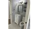 Charming powder room includes updated vanity, toilet, and modern shelving for optimal storage at 2900 W Azeele St # H, Tampa, FL 33609