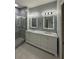 The bathroom is updated with a double vanity, marble countertop, and modern shower at 2900 W Azeele St # H, Tampa, FL 33609