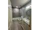 Modern bathroom featuring tiled shower and tub, stylish vanity, and updated fixtures with neutral color palette at 2900 W Azeele St # H, Tampa, FL 33609