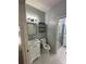 Half bath features a toilet, single sink with a marble countertop, and updated finishes at 2900 W Azeele St # H, Tampa, FL 33609