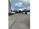 Long driveway view with a gated exit and additional street parking at 2900 W Azeele St # H, Tampa, FL 33609