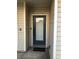 A welcoming front entrance featuring a secure door, doorbell, and a cozy welcome mat at 2900 W Azeele St # H, Tampa, FL 33609
