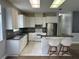 Well-equipped kitchen with granite countertops, stainless steel appliances, and a convenient breakfast bar at 2900 W Azeele St # H, Tampa, FL 33609