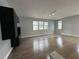 Bright and airy living room featuring hardwood floors and contemporary lighting fixtures at 2900 W Azeele St # H, Tampa, FL 33609