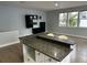 Stylish living room with a wet bar and hardwood floors, perfect for entertaining at 2900 W Azeele St # H, Tampa, FL 33609