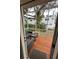 Inviting screened porch with cozy seating arrangement and a view of the surrounding greenery at 2900 W Azeele St # H, Tampa, FL 33609