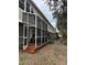 Expansive screened porch with wood flooring, ideal for outdoor entertaining and enjoying the surrounding landscape at 2900 W Azeele St # H, Tampa, FL 33609