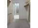 Spacious walk-in closet provides generous storage with easy access to the ensuite bathroom at 2900 W Azeele St # H, Tampa, FL 33609