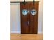 Stylish wooden barn door with porthole windows on a sliding track at 39 W Spanish Main St, Tampa, FL 33609