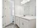 Bright bathroom features a spacious vanity with a modern sink and storage cabinets at 4228 Isonzo Way, Wesley Chapel, FL 33543