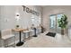 Tastefully decorated cafe seating area with light walls and tile floors at 4228 Isonzo Way, Wesley Chapel, FL 33543