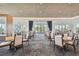 Bright clubhouse dining area with modern tables and chairs, perfect for community gatherings and events at 4228 Isonzo Way, Wesley Chapel, FL 33543