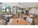 Elegant dining area with large windows, offering scenic views and a welcoming atmosphere at 4228 Isonzo Way, Wesley Chapel, FL 33543
