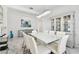 Spacious dining room showcasing modern decor, a large glass table, and plenty of seating at 4228 Isonzo Way, Wesley Chapel, FL 33543