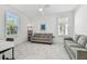 Versatile flex room features ample natural light, comfortable seating, and modern finishes, perfect for an office or den at 4228 Isonzo Way, Wesley Chapel, FL 33543