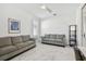 Inviting flex room with stylish furnishings, abundant light, and marble floors offers a versatile space for various uses at 4228 Isonzo Way, Wesley Chapel, FL 33543