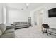 Cozy flex room offers versatile space with comfortable seating, modern decor, and seamless access to other areas at 4228 Isonzo Way, Wesley Chapel, FL 33543