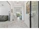 Elegant foyer with high ceilings, decorative art, and marble flooring offers a grand entrance to the home at 4228 Isonzo Way, Wesley Chapel, FL 33543