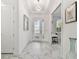 Bright and airy foyer with marble floors and recessed lighting, creating a grand entrance to the home at 4228 Isonzo Way, Wesley Chapel, FL 33543
