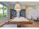 Game room with a pool table and a sitting area near a window at 4228 Isonzo Way, Wesley Chapel, FL 33543