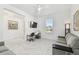 Bright living room features marble floors, a ceiling fan, and a comfortable seating area perfect for relaxing at 4228 Isonzo Way, Wesley Chapel, FL 33543