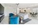Spacious living area features an open layout connecting the modern kitchen, dining area, and comfortable living space at 4228 Isonzo Way, Wesley Chapel, FL 33543