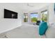 Bright main bedroom features a ceiling fan and many windows overlooking the backyard at 4228 Isonzo Way, Wesley Chapel, FL 33543