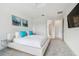 Bright main bedroom features a ceiling fan, ensuite bathroom, and access to a walk in closet at 4228 Isonzo Way, Wesley Chapel, FL 33543