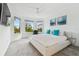Bright main bedroom features a ceiling fan and many windows overlooking the backyard at 4228 Isonzo Way, Wesley Chapel, FL 33543