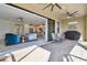Covered patio features a seamless transition to the indoor living space and a built-in barbecue area at 4228 Isonzo Way, Wesley Chapel, FL 33543
