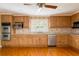 Traditional kitchen features wooden cabinets, stainless steel appliances, tile countertops, and recessed lighting at 4315 W Cleveland St, Tampa, FL 33609