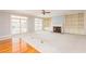 Bright living room featuring a fireplace, built-in shelving, carpet, and french doors at 4315 W Cleveland St, Tampa, FL 33609