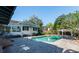 Pool with a gazebo, brick pavers, and lush landscaping at 4315 W Cleveland St, Tampa, FL 33609