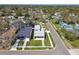 An aerial view shows the home is a charming neighborhood with tree-lined streets at 4501 24Th S Ave, St Petersburg, FL 33711
