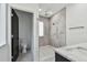 Modern bathroom featuring a tiled shower, a toilet, and a sink with a marble countertop at 4501 24Th S Ave, St Petersburg, FL 33711