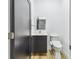 A modern bathroom with a sleek black vanity, toilet with bidet, and a minimalist mirror at 4501 24Th S Ave, St Petersburg, FL 33711