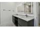 Modern bathroom featuring double vanity, marble countertops and a large, lighted mirror at 4501 24Th S Ave, St Petersburg, FL 33711