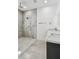 Modern bathroom featuring a walk-in shower, marble countertops, and sleek fixtures at 4501 24Th S Ave, St Petersburg, FL 33711