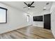 Bright bedroom with luxury vinyl plank flooring, ceiling fan and black door at 4501 24Th S Ave, St Petersburg, FL 33711